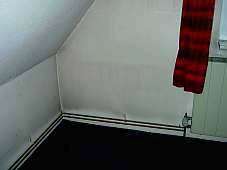 Dirty wall in a living room by convector heating