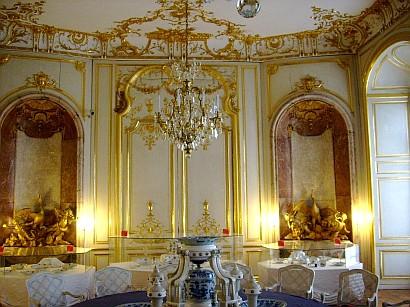 Rococo-garden castle / pleasure palace dining room with gilt piece work / carvings and ceiling stucco and china / porcelain centrepiece